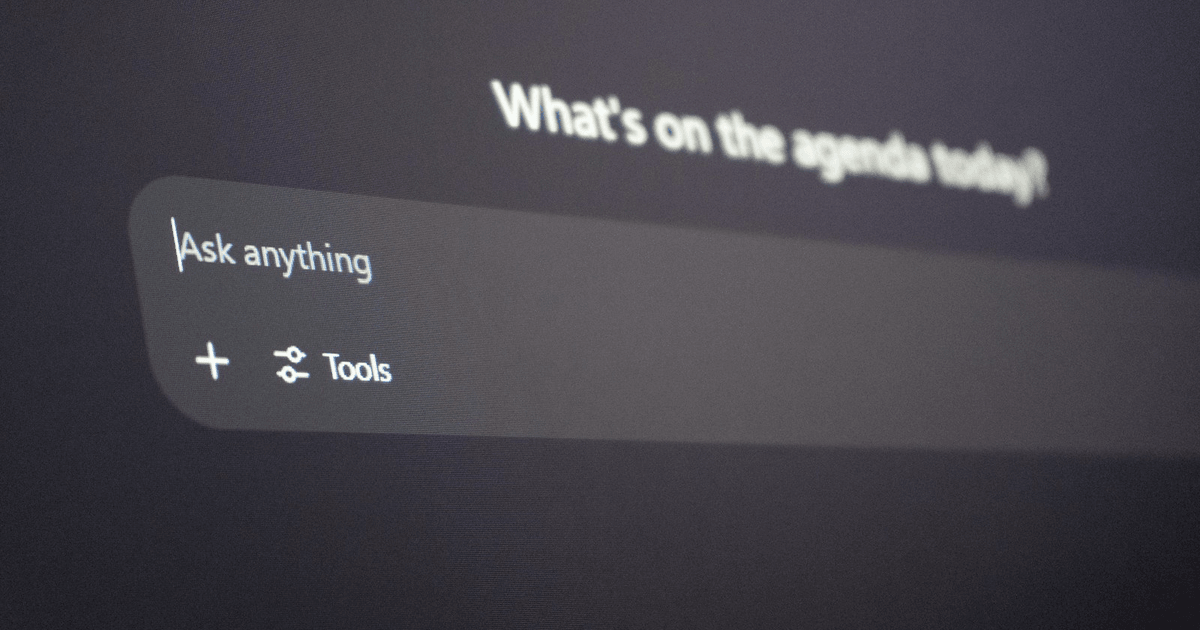 ChatGPT interface open on a computer screen in a small office