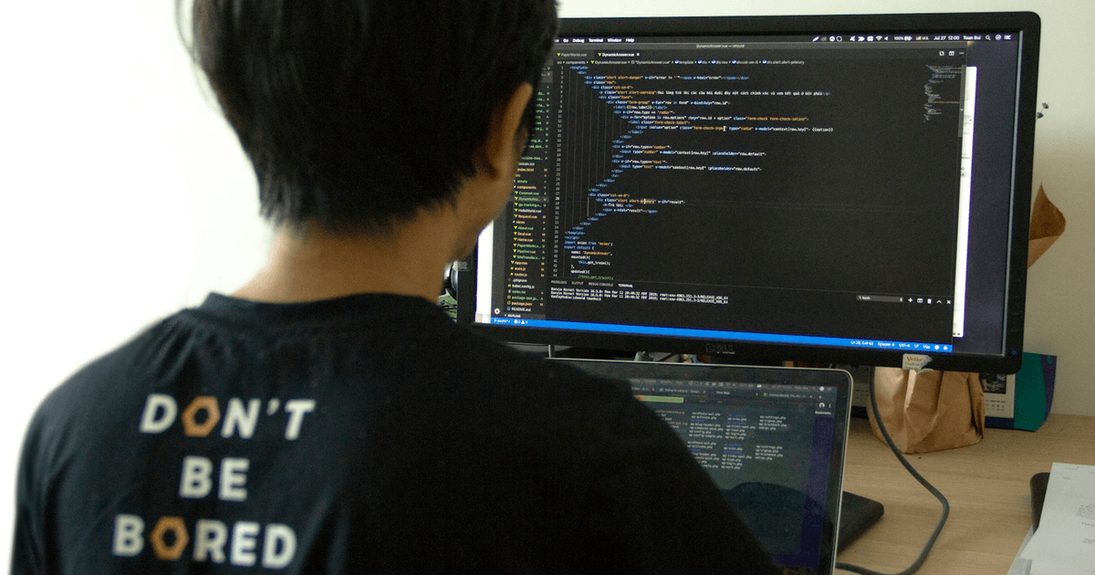 Developer fixing broken WordPress code on monitor during website rescue project